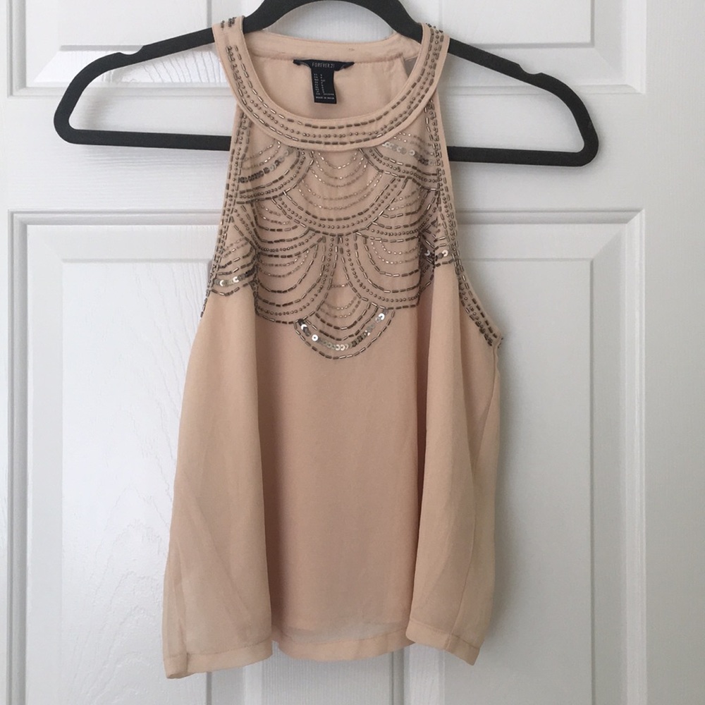 Short length blush colored blouse